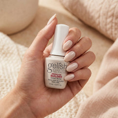 Mano sosteniendo builder gel Gelish Brush-On Builder Ivory Nude