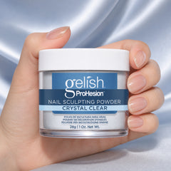 Mano sosteniendo polvo acrílico Gelish ProHesion Nail Sculpting Powder Crystal Clear